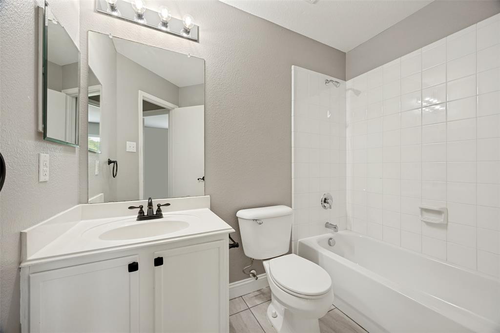 1601 Elm Street Anna, TX 75409 - Photo 18 of 25 a bathroom with a sink toilet and shower