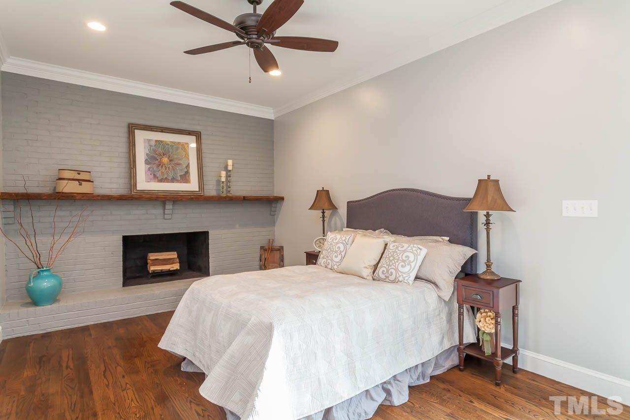 2333 Mt Vernon Church Road Raleigh, NC 27614 - Photo 11 of 24 a bedroom with a bed and a fireplace