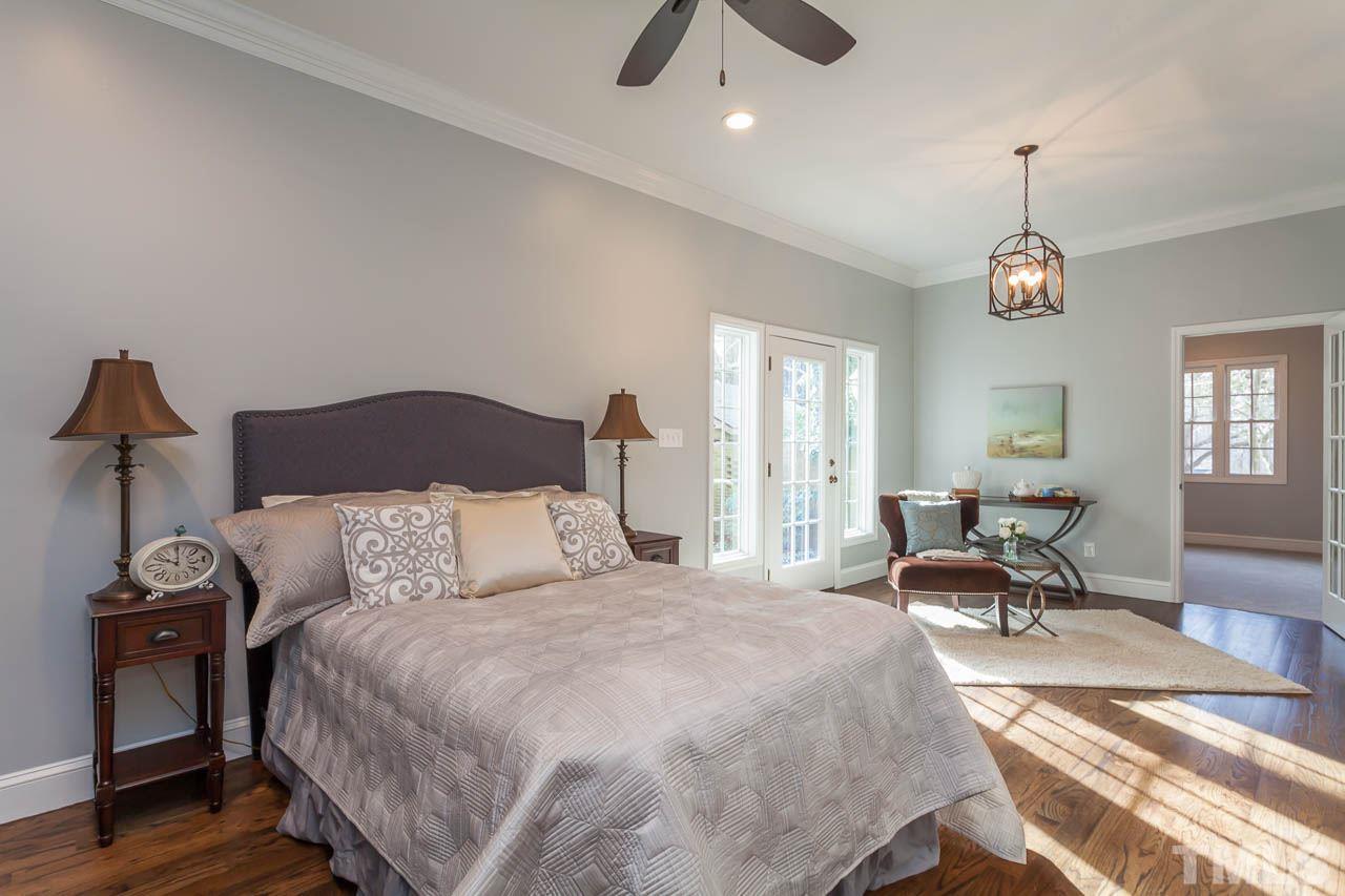2333 Mt Vernon Church Road Raleigh, NC 27614 - Photo 12 of 24 a bedroom with a bed and a chandelier