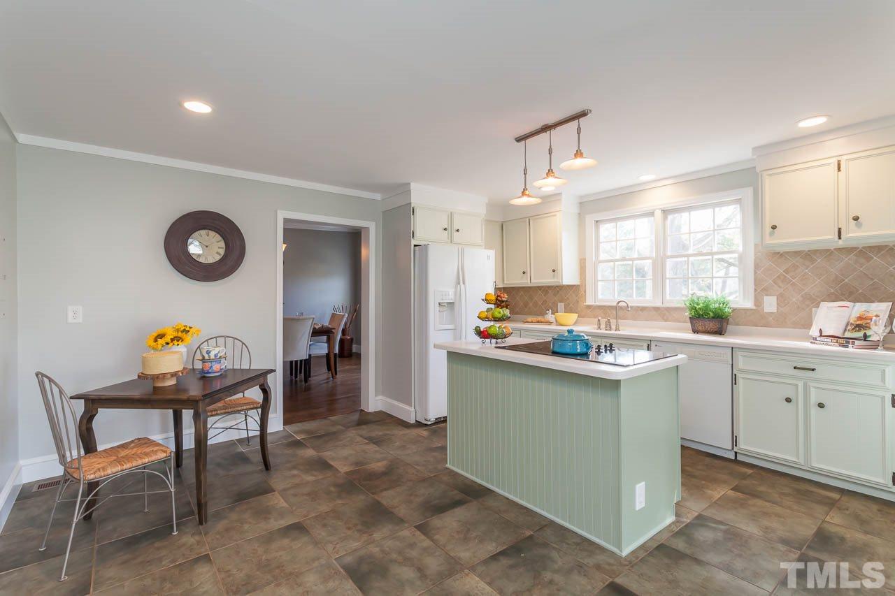 2333 Mt Vernon Church Road Raleigh, NC 27614 - Photo 6 of 24 a kitchen with a sink cabinets and window