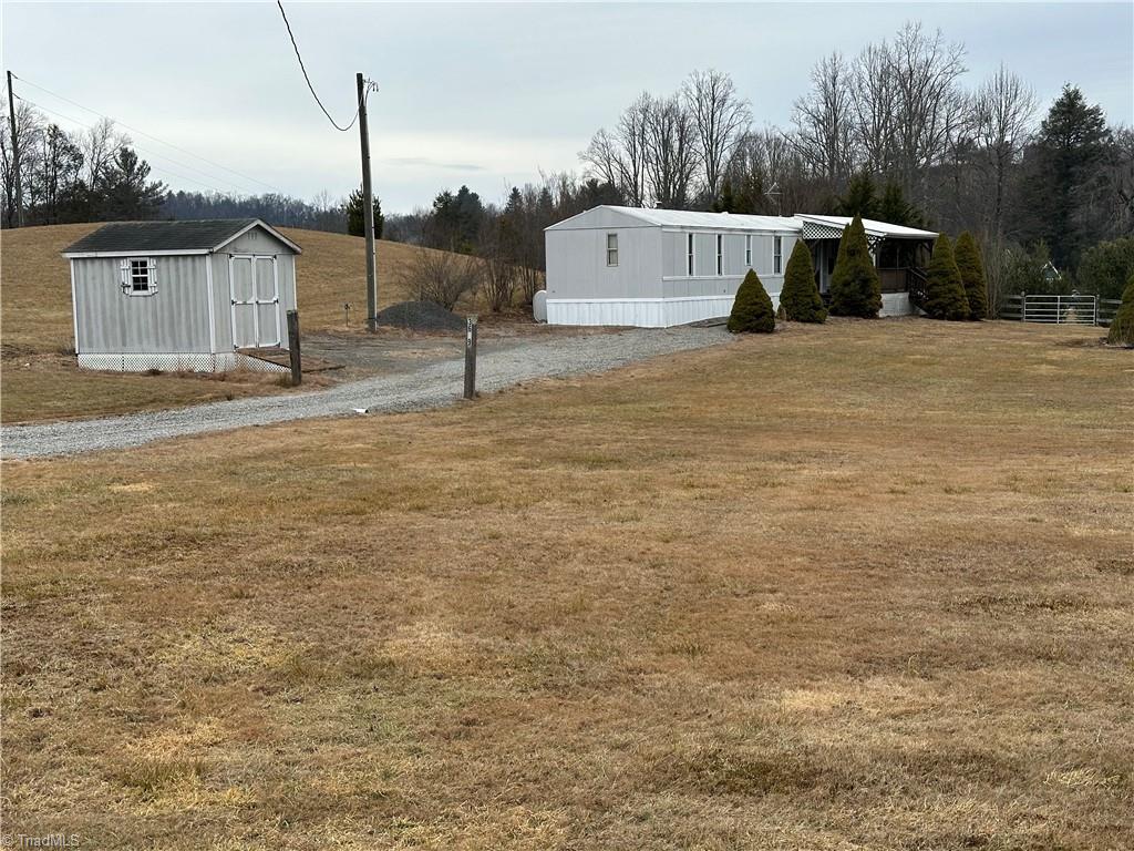 3661 Darnell Woodie Road Laurel Springs, NC 28644 - Photo 25 of 29 View from shared driveway and 120SF Storage Shed