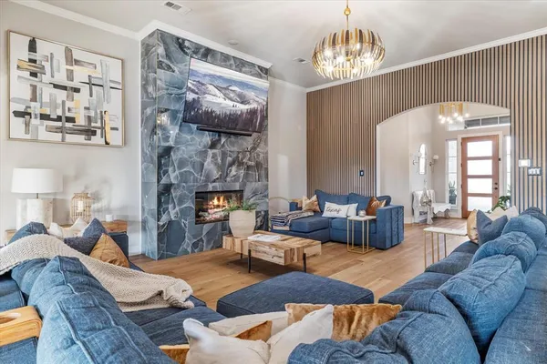 a view of livingroom with furniture wooden floor and windows