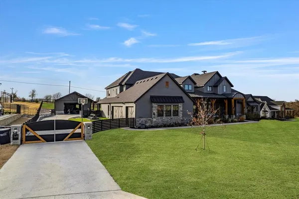 an aerial view of a house with outdoor space