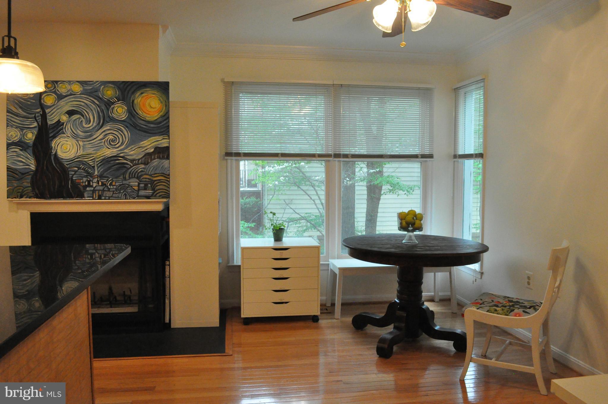 1102 Arcola Avenue Silver Spring, MD 20902 - Photo 14 of 30 a view of a workspace with furniture and a window