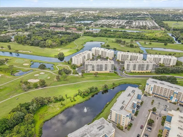 an aerial view of a house with a big yard
