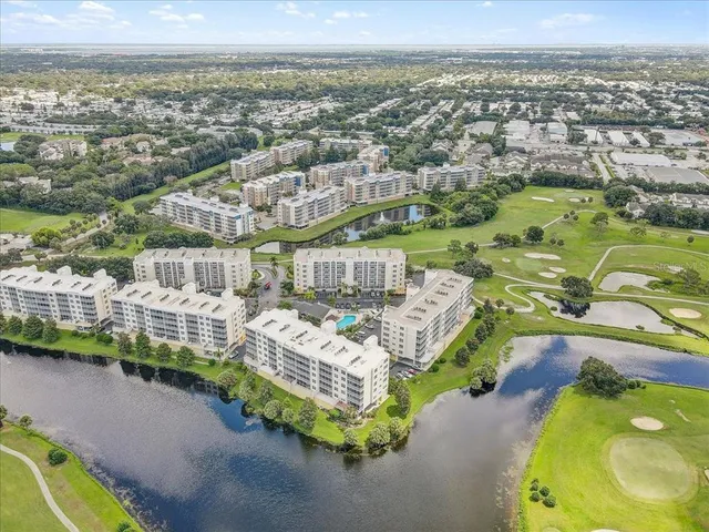 an aerial view of a house with a ocean view