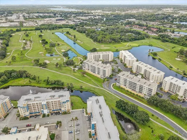 an aerial view of a city with a lake
