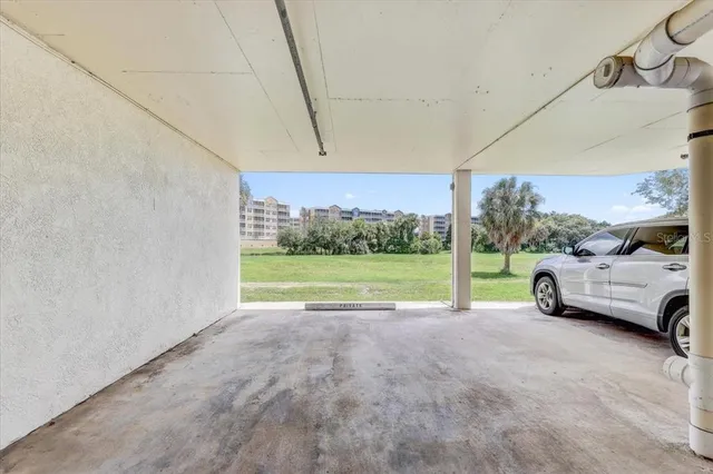 a view of a yard with car parked