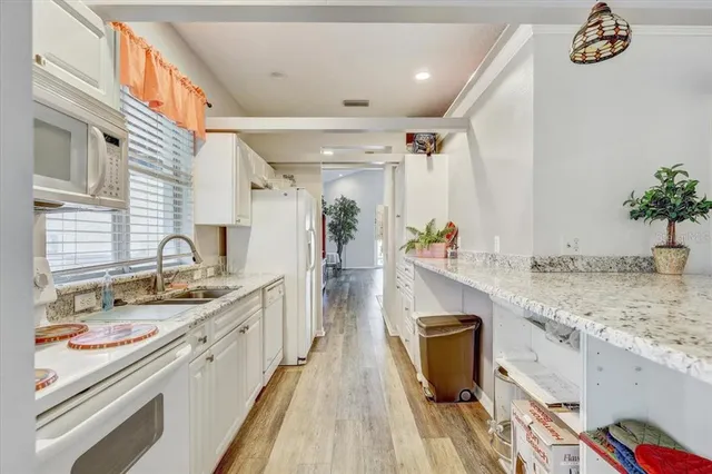 a view of a kitchen with a sink and dishwasher