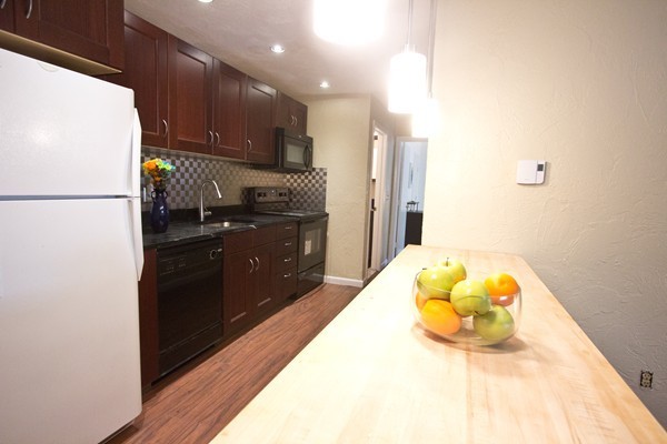 188 Swanson Road, Unit 326 Boxborough, MA 01719 - Photo 5 of 14 a kitchen with stainless steel appliances a refrigerator and a stove
