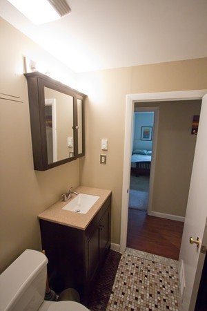 188 Swanson Road, Unit 326 Boxborough, MA 01719 - Photo 7 of 14 a bathroom with a sink and a mirror