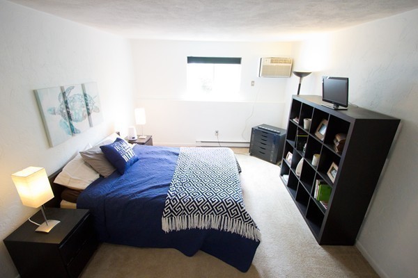 188 Swanson Road, Unit 326 Boxborough, MA 01719 - Photo 9 of 14 a bedroom with a bed and wooden floor