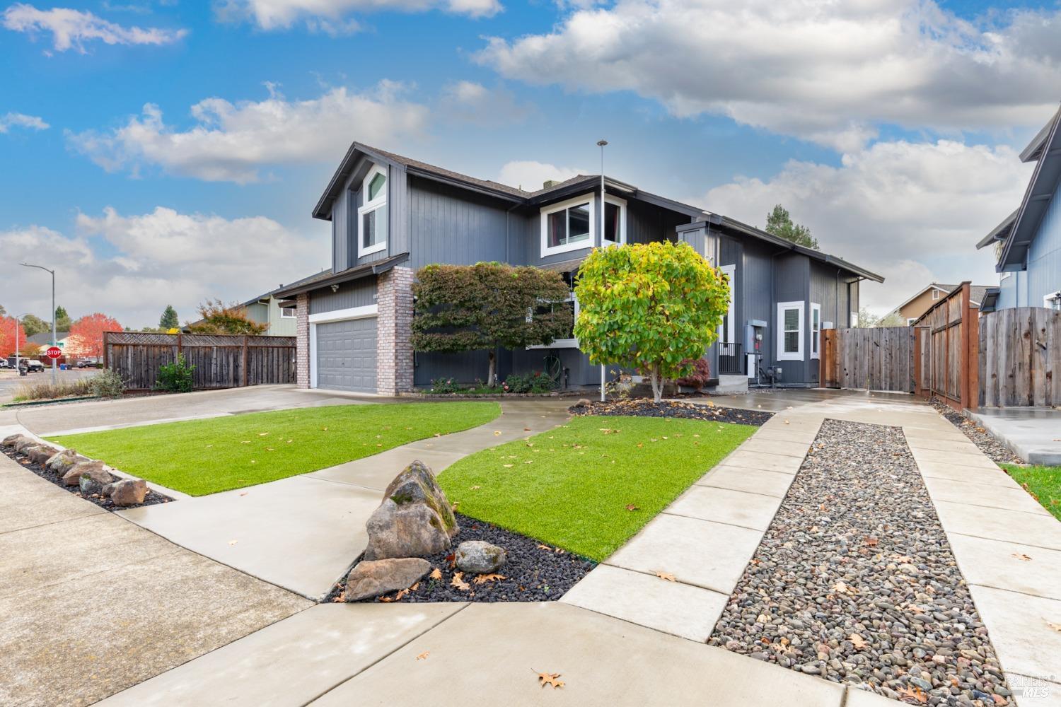 a front view of a house with a yard and porch