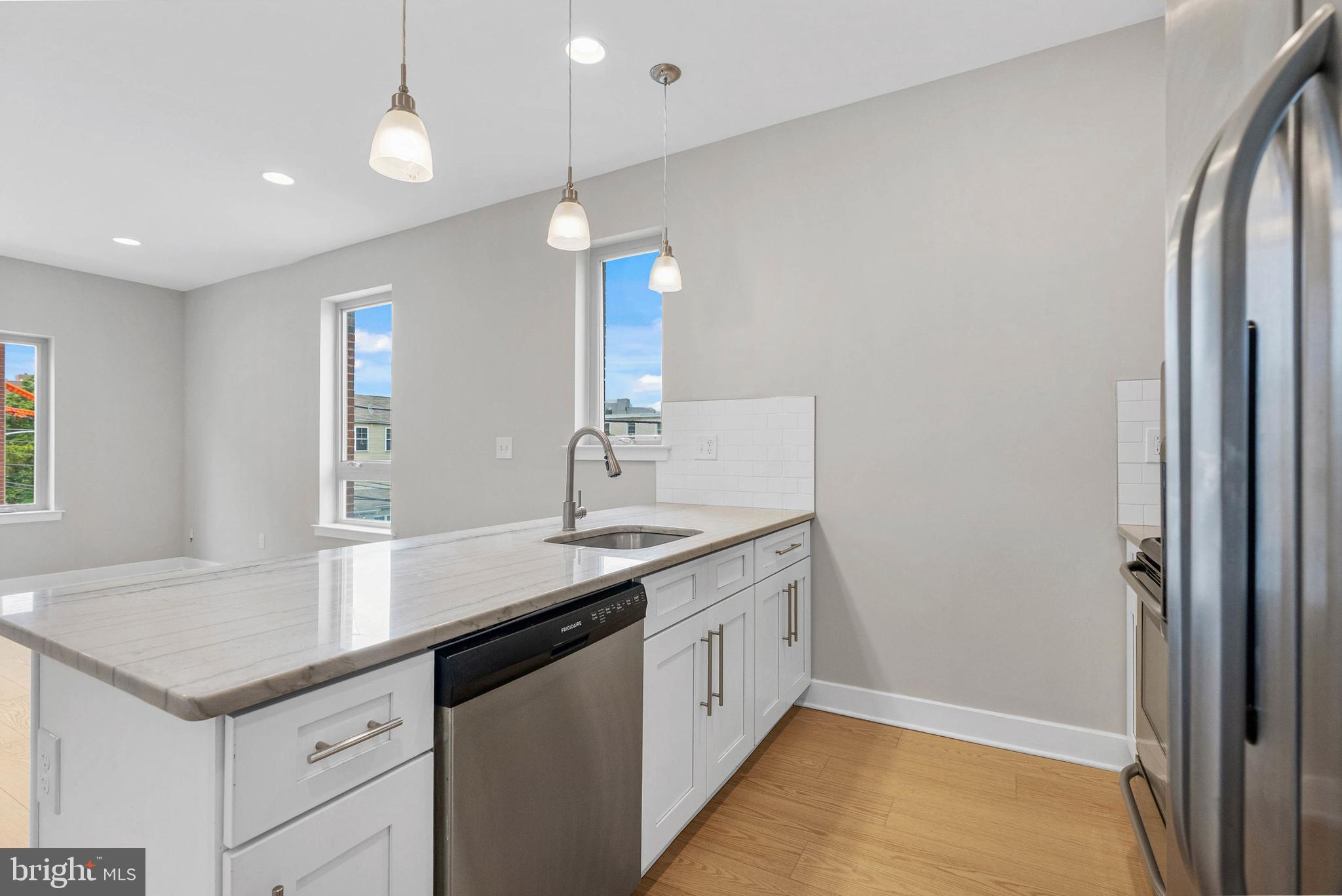 1238 North 6th Street, Unit B Philadelphia, PA 19122 - Photo 3 of 21 a kitchen with a sink and a refrigerator