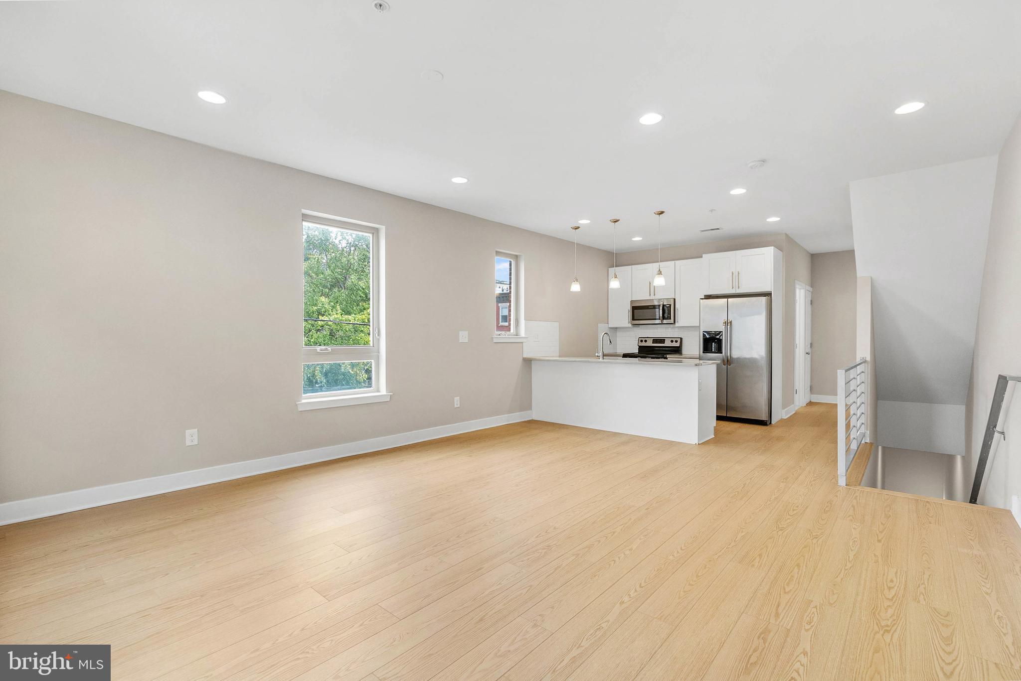 1238 North 6th Street, Unit B Philadelphia, PA 19122 - Photo 5 of 21 a view of a kitchen with a sink refrigerator and a window