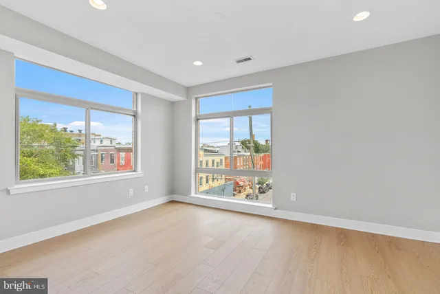 a view of an empty room with a window