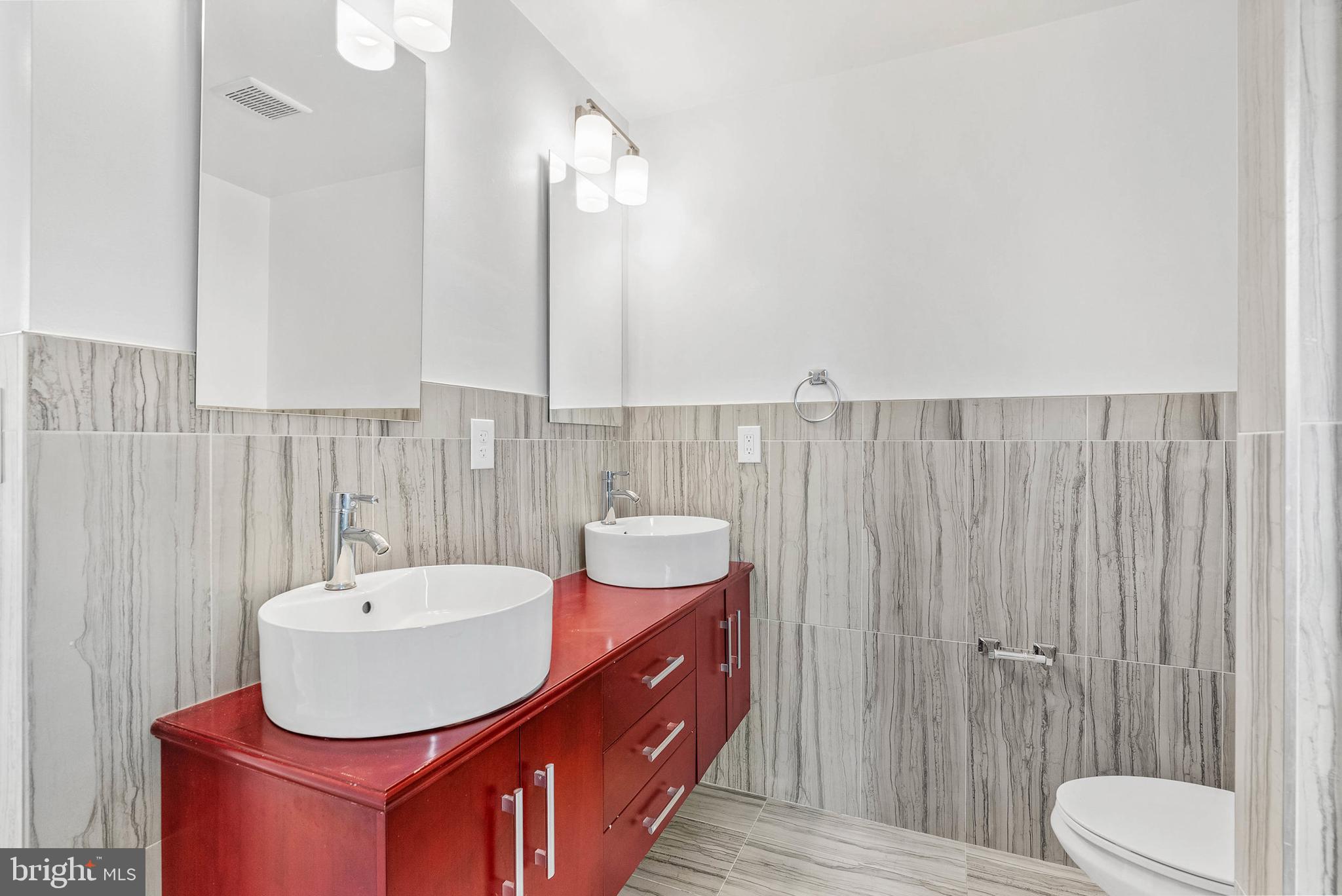 1238 North 6th Street, Unit B Philadelphia, PA 19122 - Photo 9 of 21 a bathroom with a sink a toilet and shower