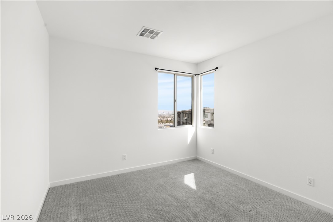 633 Infinity Rdg Street Las Vegas, NV 89138 - Photo 16 of 30 Carpeted empty room featuring baseboards