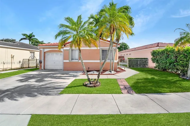 a view of a backyard with a garden and plants