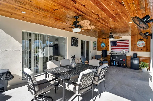 a outdoor space with lots of tables and chairs