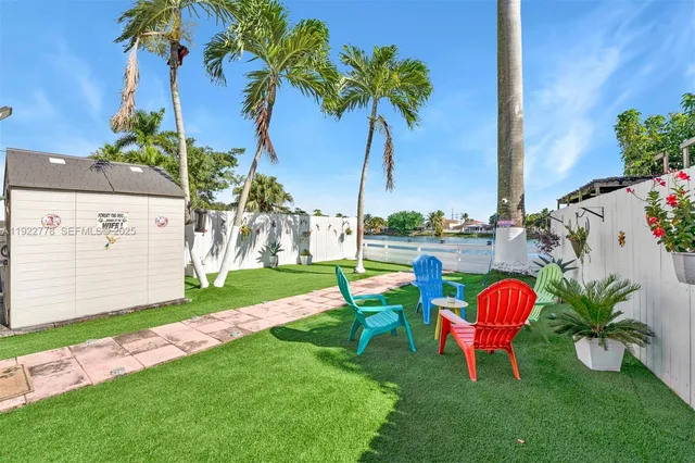 a view of a table and chairs in the garden