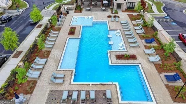 a swimming pool with outdoor seating