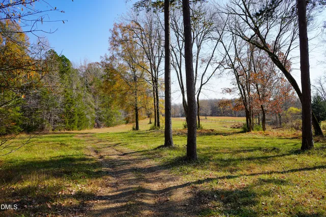 a view of a house with backyard porch and furniture