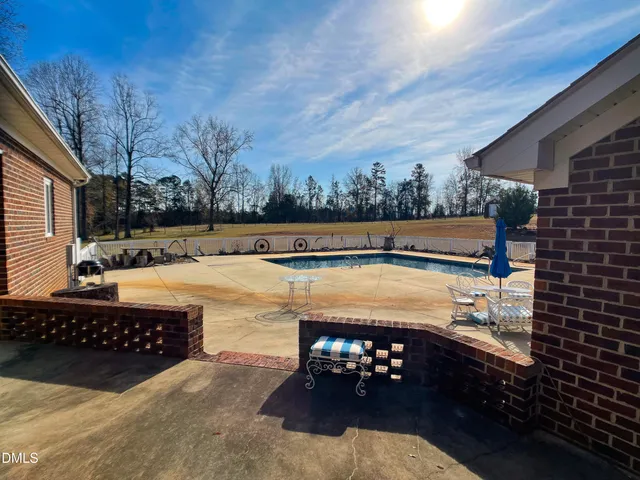a spacious bedroom with a bed and a window