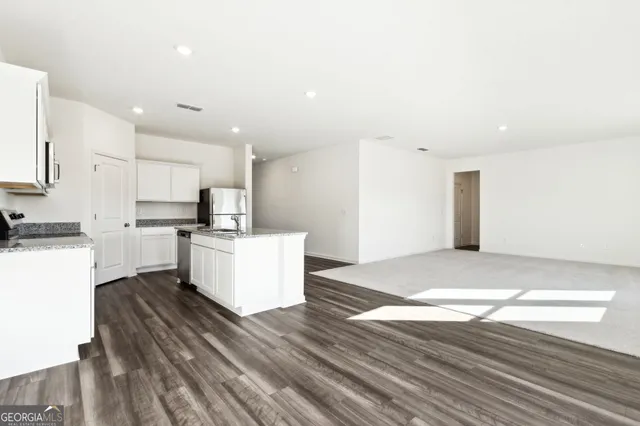 a view of kitchen with wooden floor