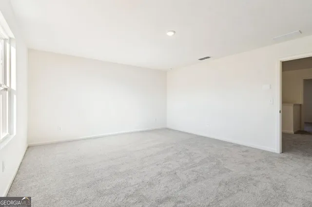 an empty room with a natural light
