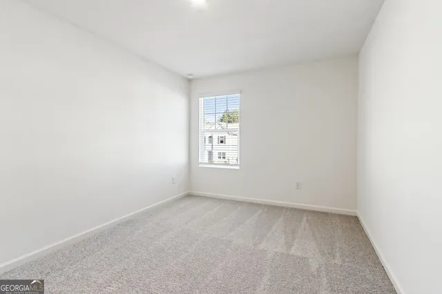 an empty room with a bathroom