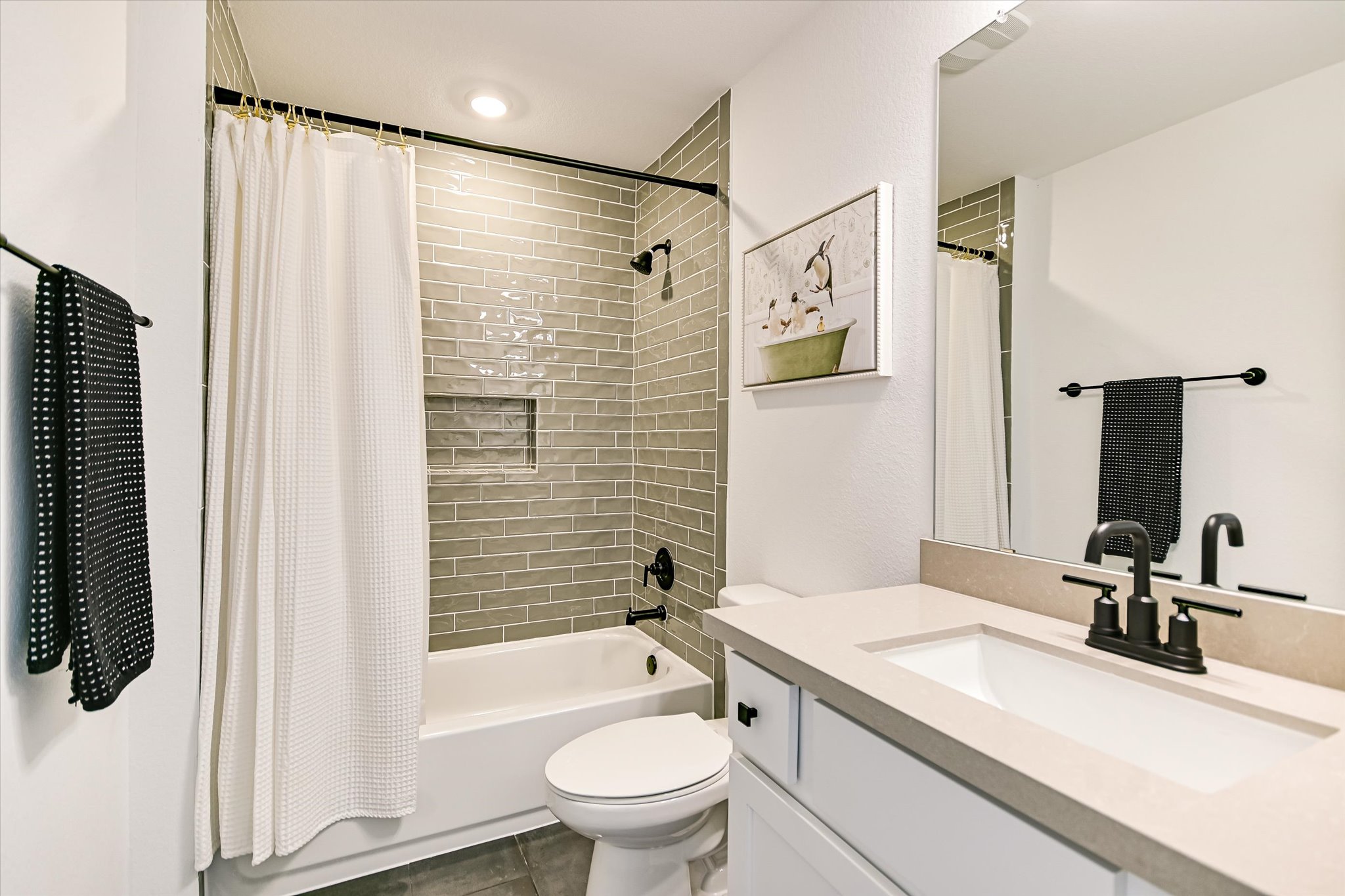 1928 Varese Path Leander, TX 78641 - Photo 16 of 31 Bathroom with a shower/ bath tub combination for children who love playing with their water toys and sticking letters/animals/
numbers on the tile wall. Plus, an easy cleanup when kids are done and ready for bed.