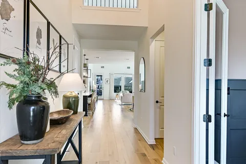 a view of a hallway with seating area