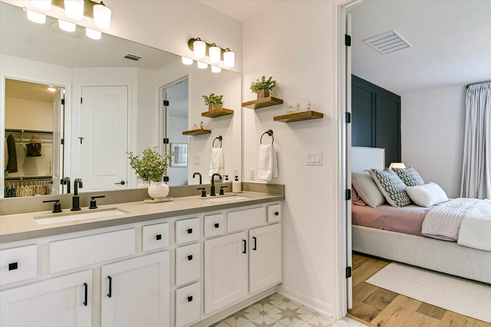 1928 Varese Path Leander, TX 78641 - Photo 9 of 31 The ensuite primary bathroom has plenty of room for two people to get ready for work in the morning without getting in each other's way.