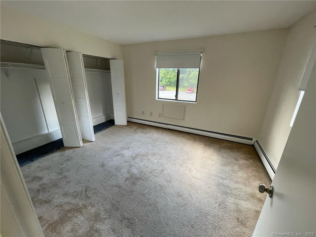 565 Talcottville Road, Unit 2B7 Vernon, CT 06066 - Photo 7 of 10 an empty room with windows
