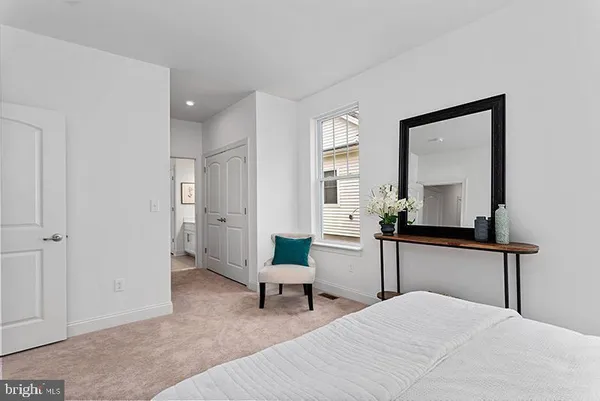 a room with a bed and a chair