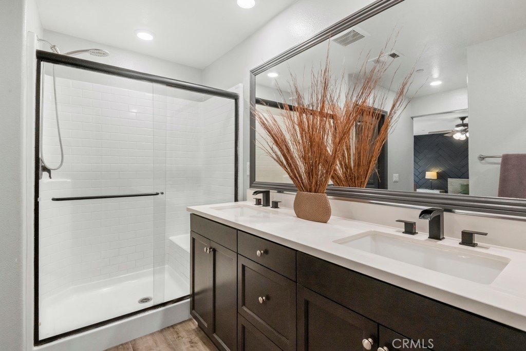1148 Little Leaf Street Calimesa, CA 92320 - Photo 13 of 31 a bathroom with a double vanity sink mirror and double