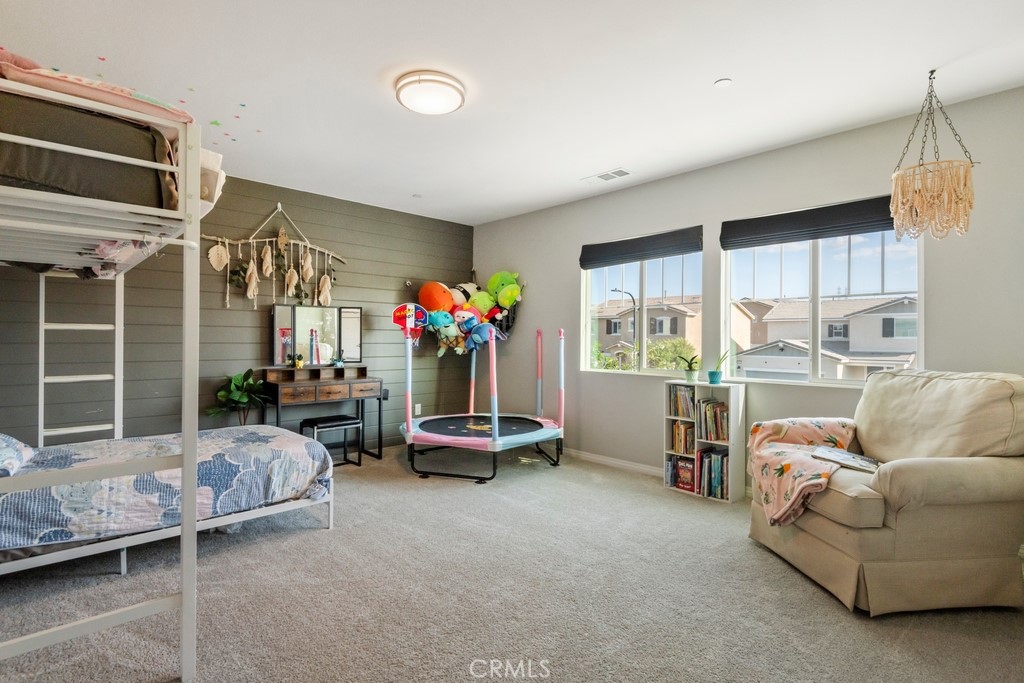 1148 Little Leaf Street Calimesa, CA 92320 - Photo 14 of 31 a living room with furniture and a floor to ceiling window