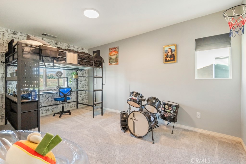 1148 Little Leaf Street Calimesa, CA 92320 - Photo 16 of 31 a view of a room with gym equipment
