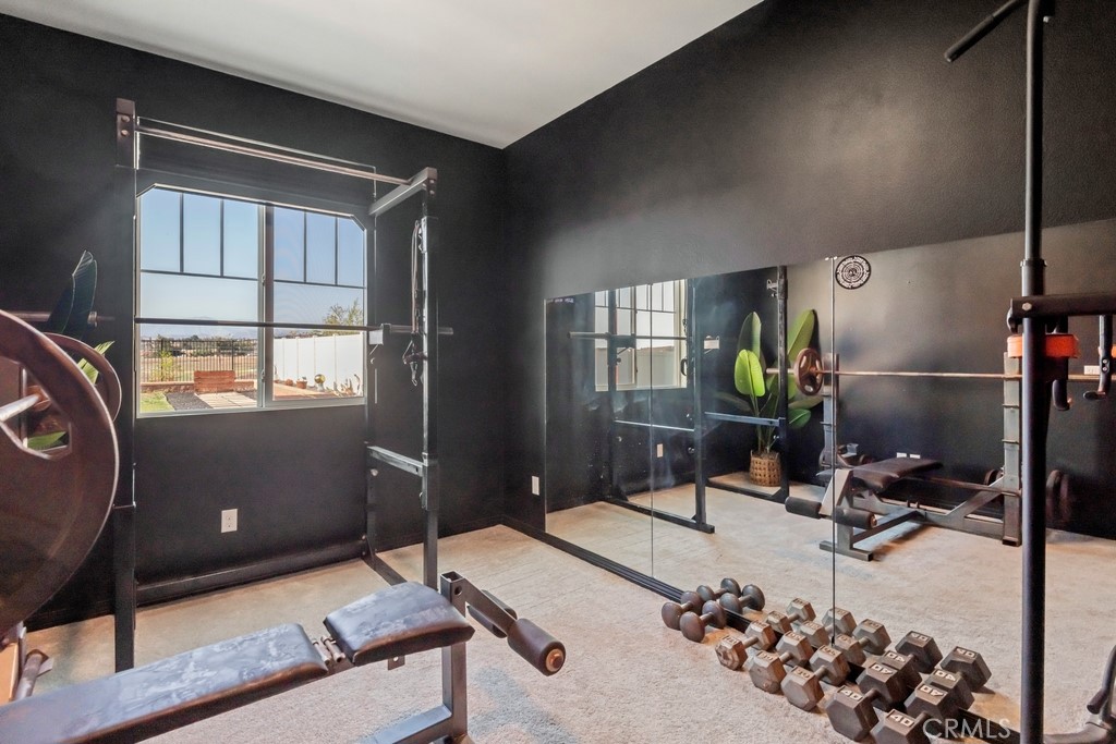 1148 Little Leaf Street Calimesa, CA 92320 - Photo 17 of 31 a room with gym equipment and a window