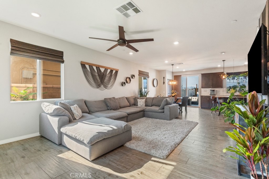 1148 Little Leaf Street Calimesa, CA 92320 - Photo 2 of 31 a living room with furniture kitchen view and a window