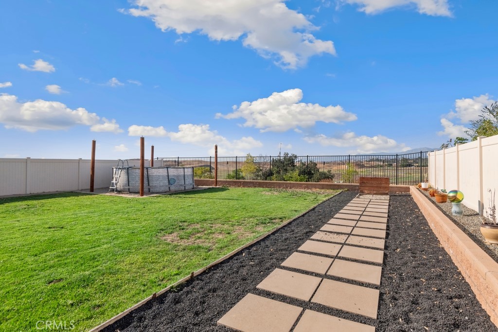 1148 Little Leaf Street Calimesa, CA 92320 - Photo 23 of 31 a view of a backyard with sitting area