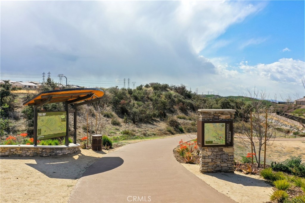 1148 Little Leaf Street Calimesa, CA 92320 - Photo 27 of 31 a front view of a house with a yard and mountain
