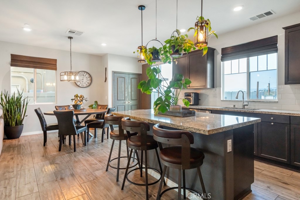 1148 Little Leaf Street Calimesa, CA 92320 - Photo 7 of 31 a very nice looking dining room with a table and chairs