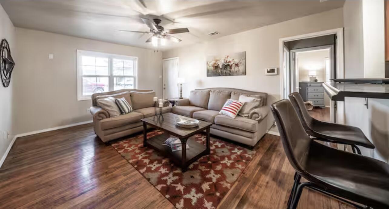 3621 31st Street Lubbock, TX 79410 - Photo 2 of 14 a living room with furniture and a large window