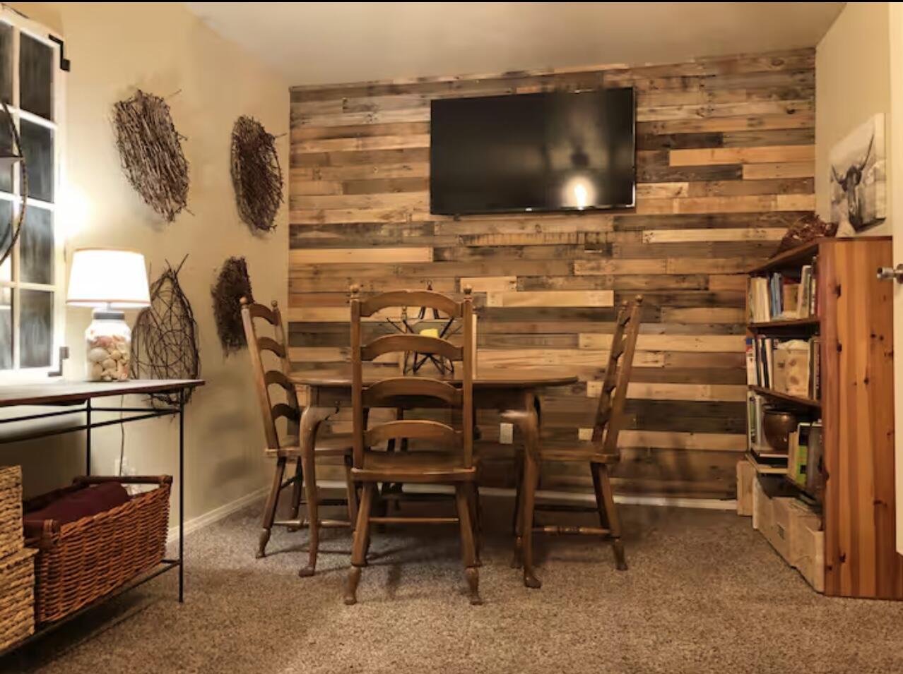3621 31st Street Lubbock, TX 79410 - Photo 6 of 14 a dining room with furniture and a flat screen tv