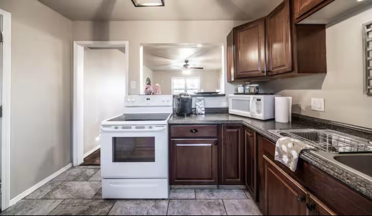 3621 31st Street Lubbock, TX 79410 - Photo 8 of 14 a kitchen with a sink stove and oven