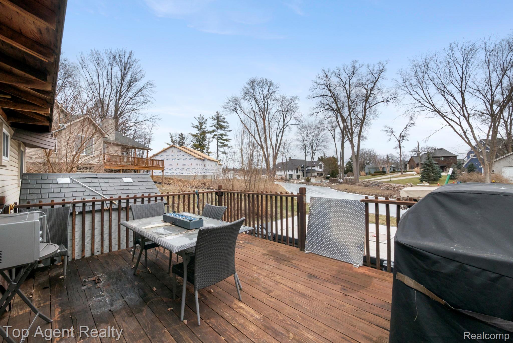 2065 Ridgemont Street Commerce Township, MI 48382 - Photo 28 of 35 Deck with area for grilling, a residential view, and outdoor dining space