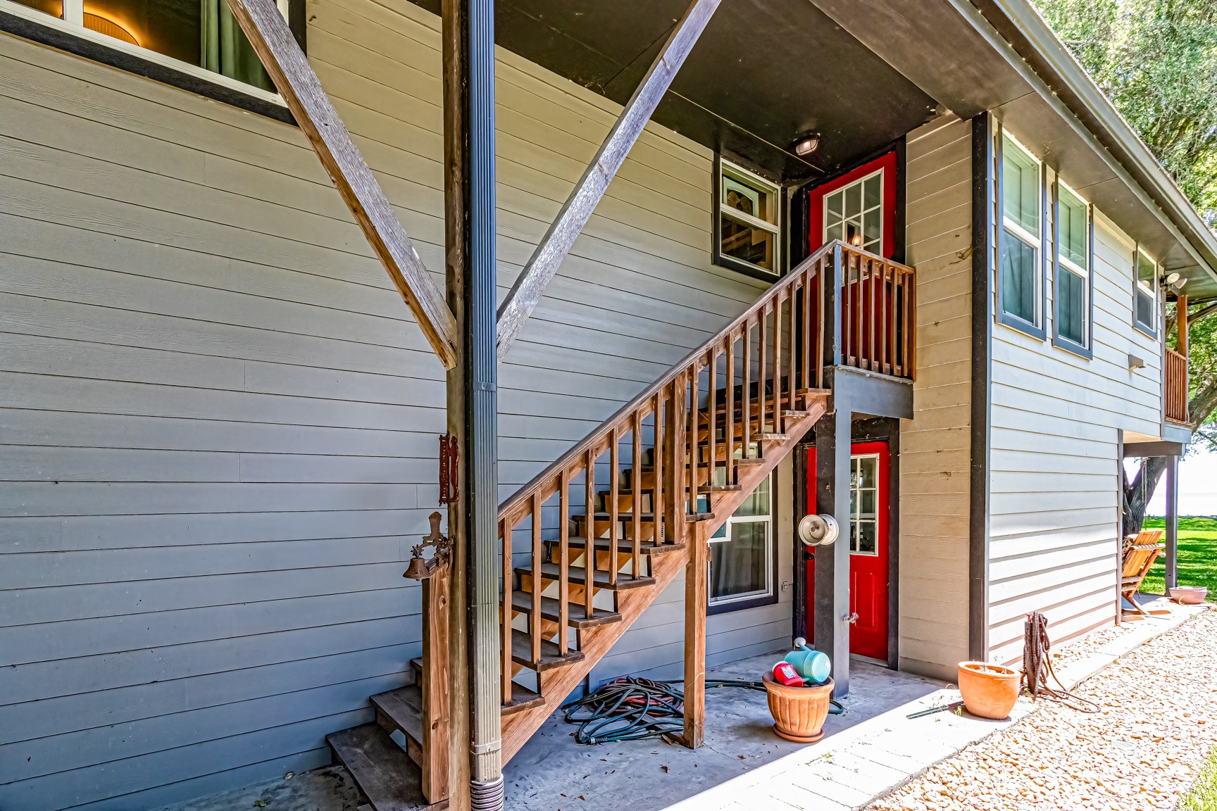 480 Johnson Road Coldspring, TX 77331 - Photo 18 of 49 Direct access to upstairs or down from the outside making it easy to divide this into 2 separate living spaces, or one larger home using a 2nd staircase inside the home. This home has many possibilities!