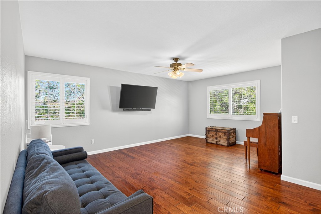 31928 Cercle Chambertin Temecula, CA 92591 - Photo 48 of 74 a living room with furniture and a flat screen tv